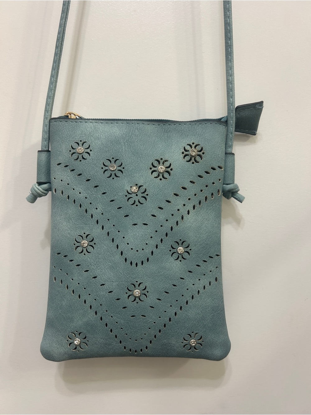 Mini Crossbody with Laser Cut and Embellished Design.